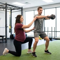 Patient working with a provider at a CrossFit physical therapy clinic in Fort Worth